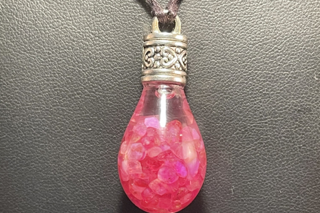 Ruby UV reactive Globe Amulet